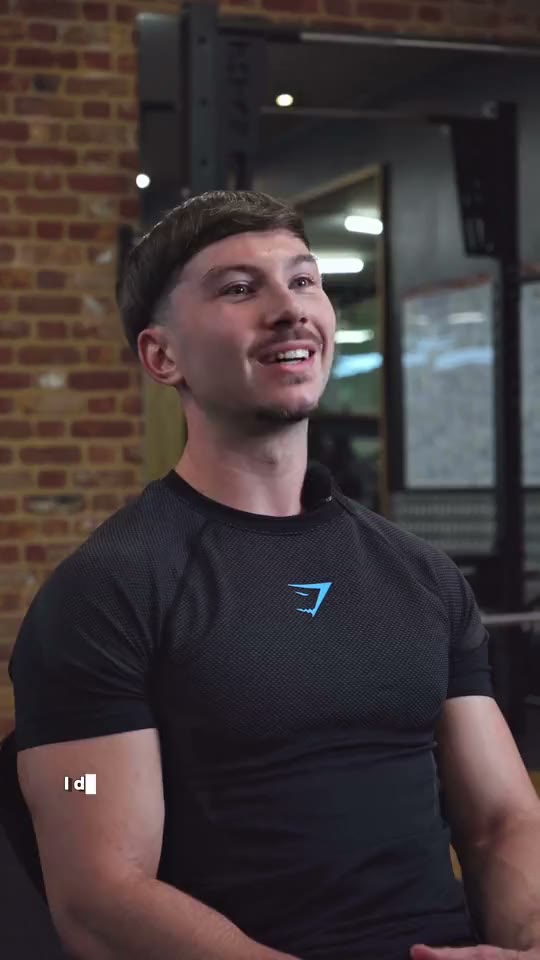 Harrison, a personal trainer, being interviewed in a gym